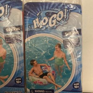 New and back swimming rings, one red one blue with a design on top